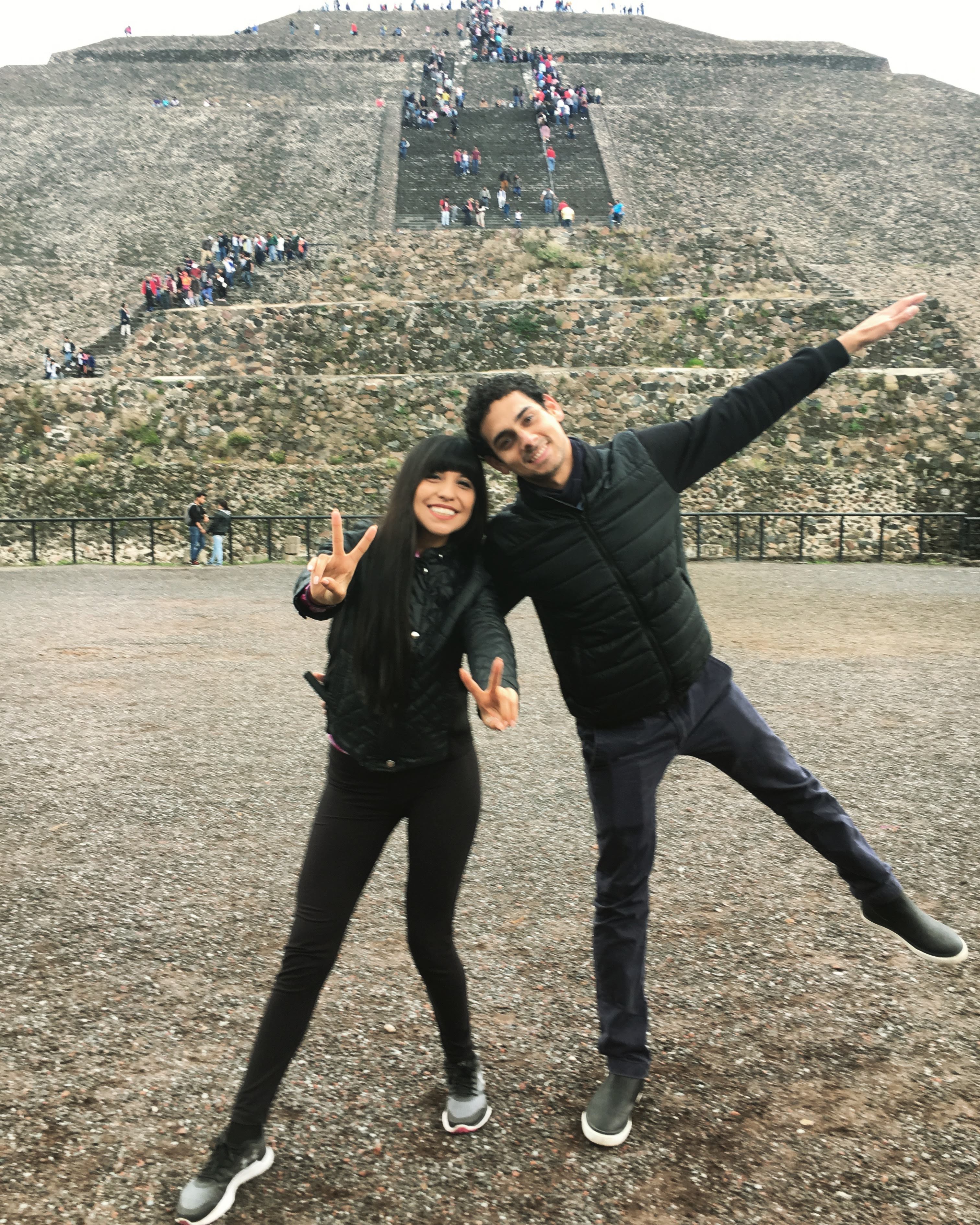 Couple wearing all black in front of the Pyramid of the Sun in Mexico Teotihuacan Pyramids