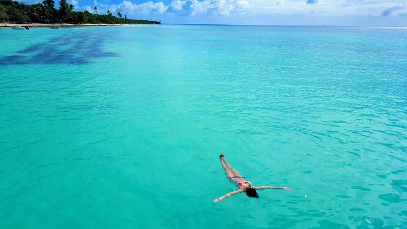 Girl floating in the Caribbean Sea near Punta Cana