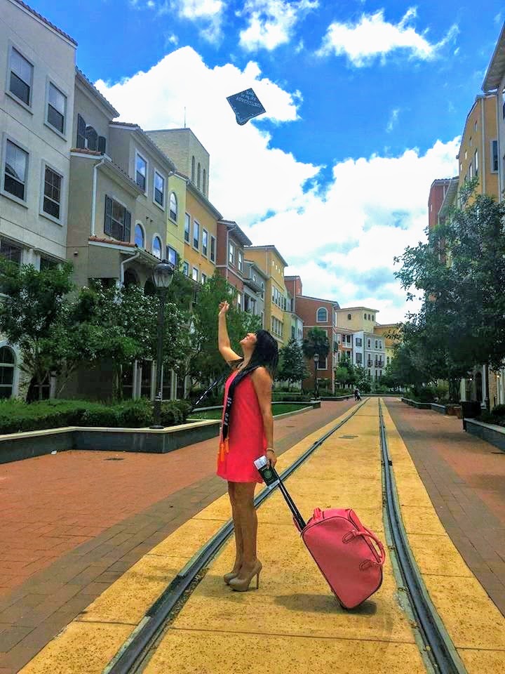 graduation cap and travel suitcase photo